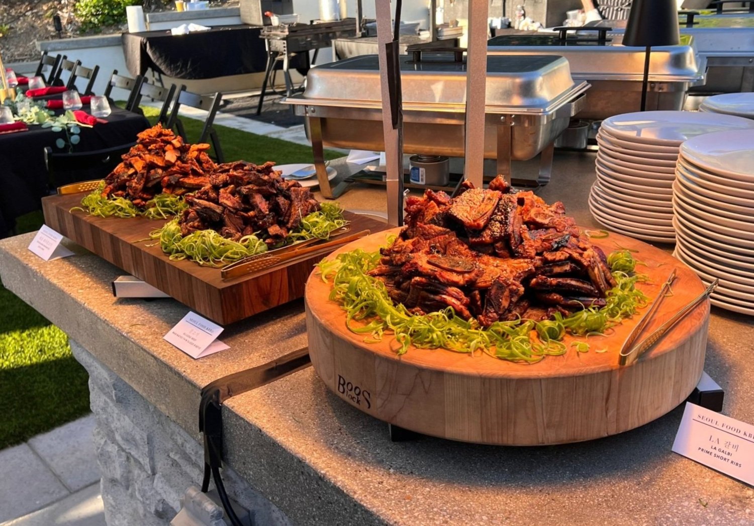 Korean BBQ buffet catering spread with grilled meats and side dishes