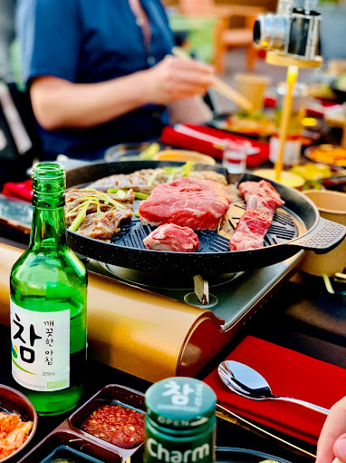 Korean barbecue steaks cooked on a table-top grill traditional Korean style